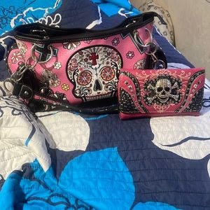 A beautiful pink with a beautiful pink wallet that matches. A Montana purse.